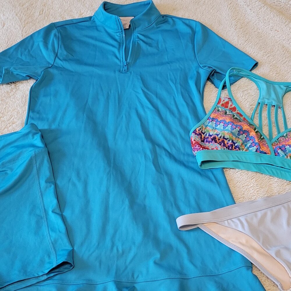 Swimsuit cover up, SPF 50, sport swim top, cheeky swim bottoms, and shorts.